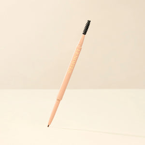 Brow Micro Sculpting Pencil in Taupe by Lenoites, featuring a dual-ended pencil with a spoolie brush on one end and a fine pencil tip on the other, displayed against a soft beige background.